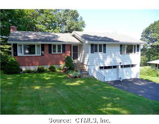 a view of a house with a garden and deck