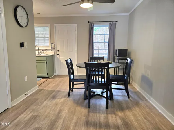 a dining room with furniture and window