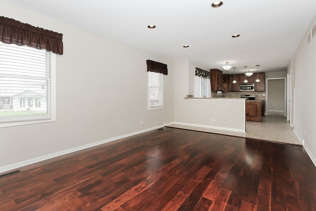 2784 Randall Ridge Drive Elgin, IL 60124 - Photo 11 of 20 a view of an empty room with window and wooden floor