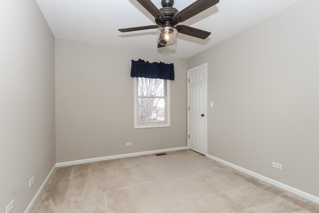 2784 Randall Ridge Drive Elgin, IL 60124 - Photo 16 of 20 an empty room with a window and a fan