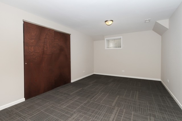 2784 Randall Ridge Drive Elgin, IL 60124 - Photo 19 of 20 an empty room with a workbench