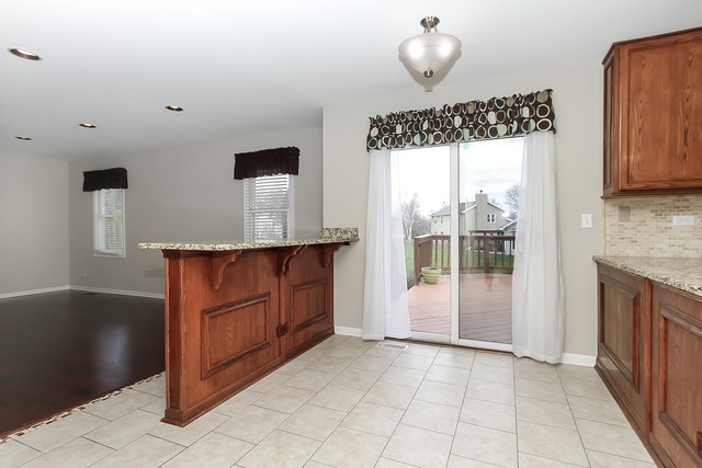 2784 Randall Ridge Drive Elgin, IL 60124 - Photo 8 of 20 a bathroom with a granite countertop sink a mirror and shower