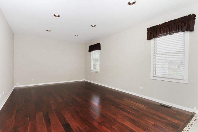 2784 Randall Ridge Drive Elgin, IL 60124 - Photo 10 of 20 an empty room with wooden floor and windows
