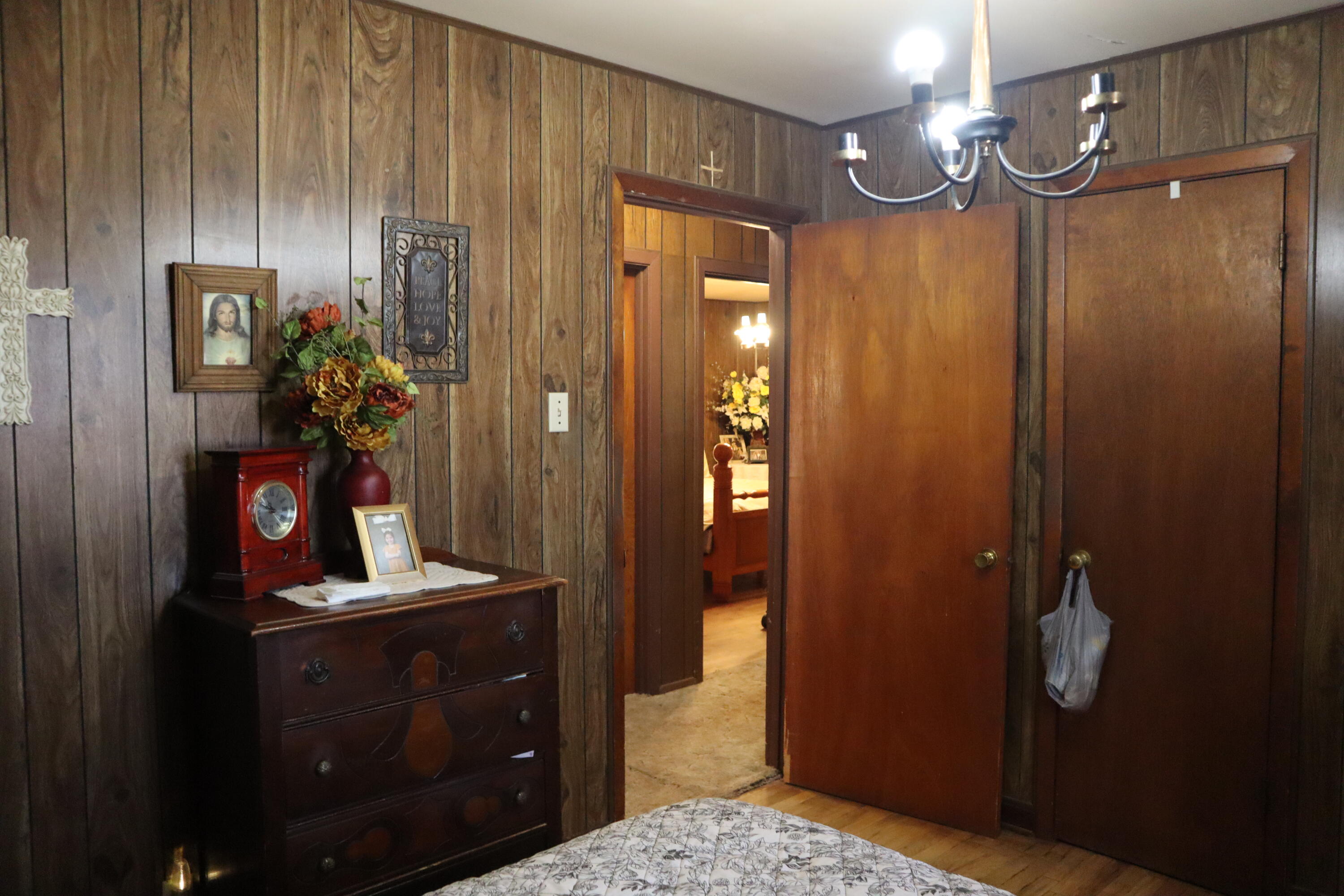 5993 Jaguar Road Levelland, TX 79336 - Photo 11 of 24 a view of a hallway with chandelier