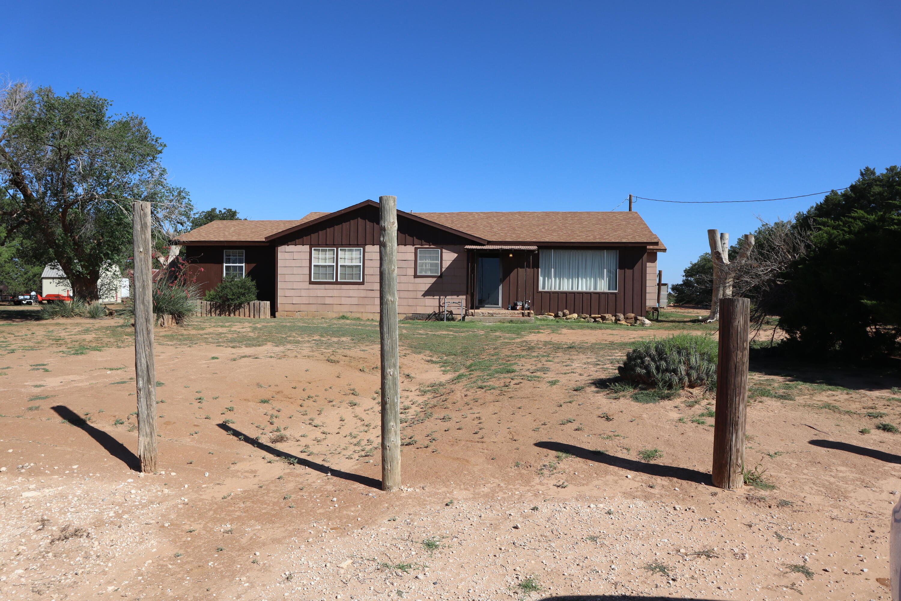 5993 Jaguar Road Levelland, TX 79336 - Photo 19 of 24 a front view of a house with a yard