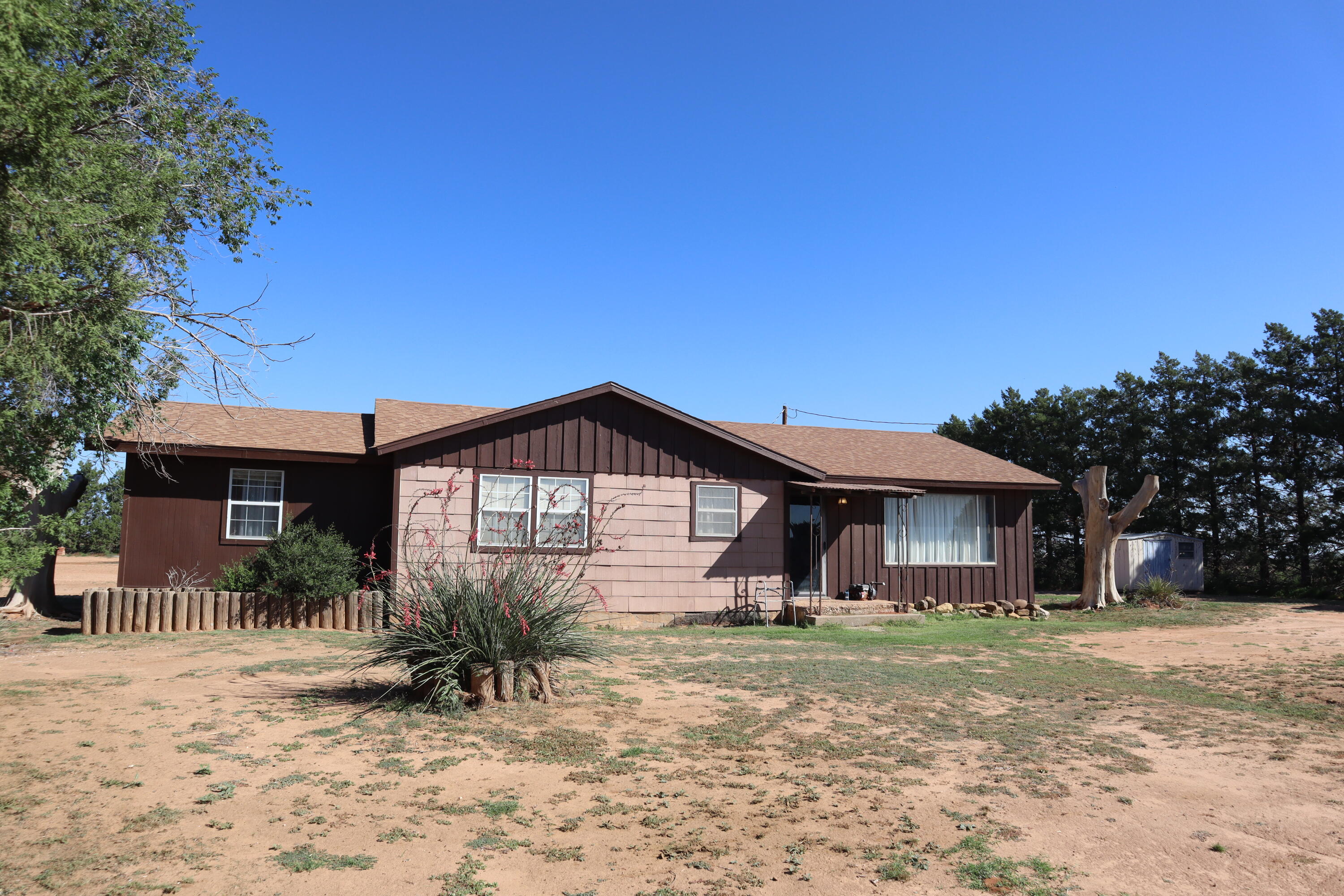 5993 Jaguar Road Levelland, TX 79336 - Photo 2 of 24 a front view of a house with a yard