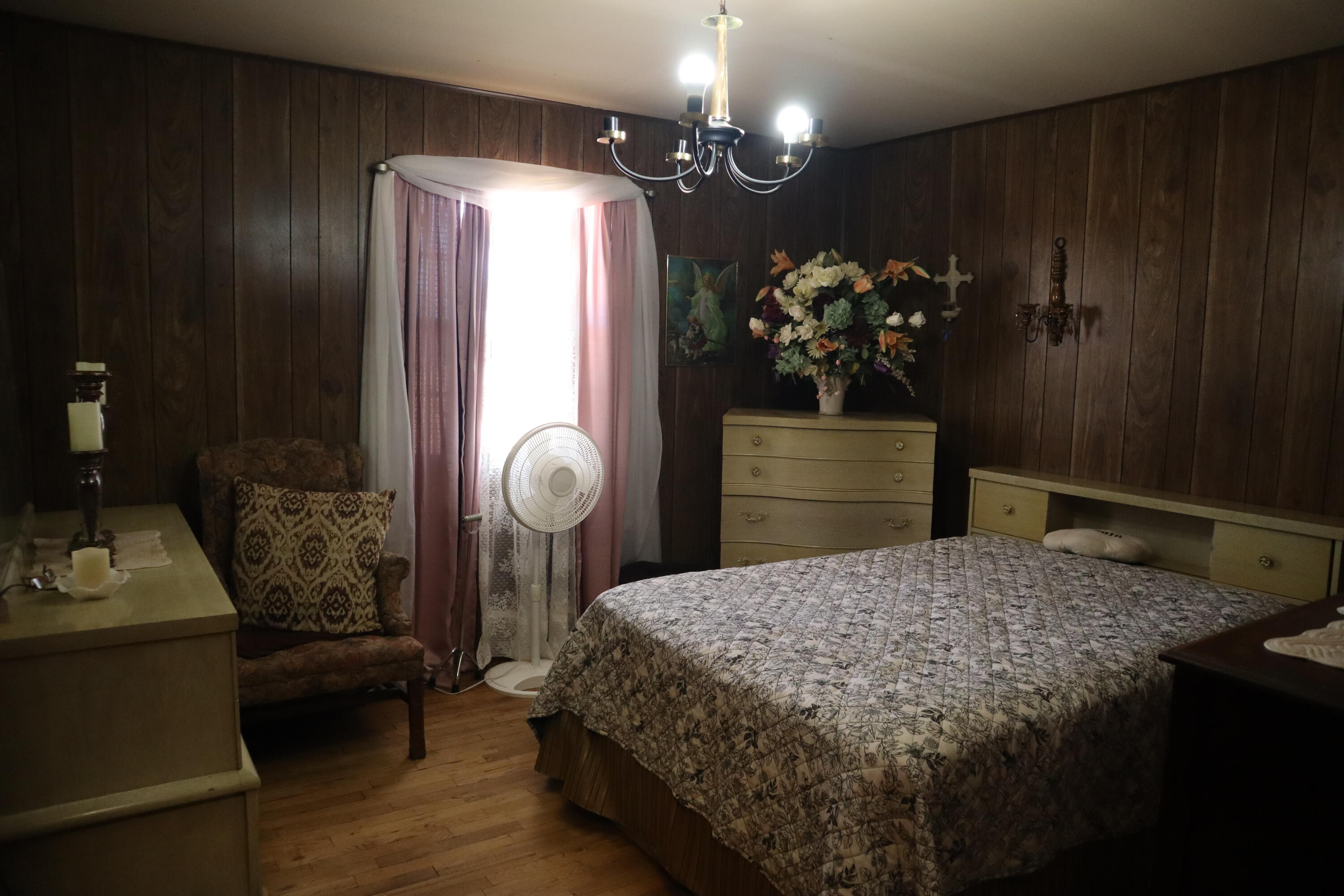 5993 Jaguar Road Levelland, TX 79336 - Photo 9 of 24 a bed room with a bed mirror and a table