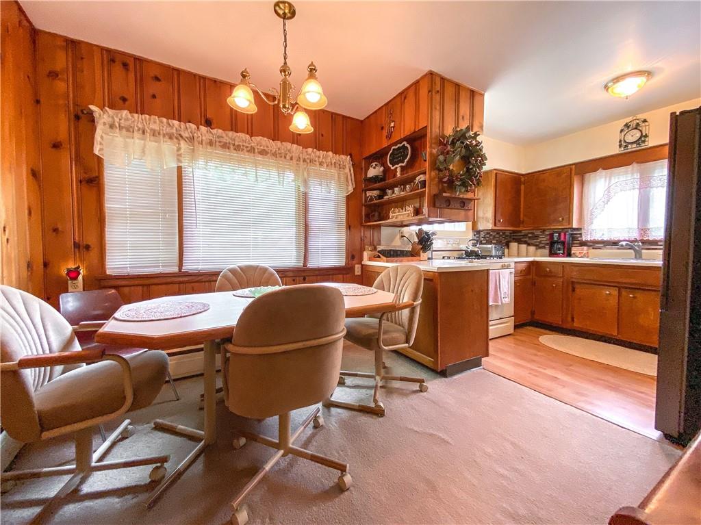 145 Stuber Road New Brighton, PA 15066 - Photo 13 of 27 a kitchen with stainless steel appliances granite countertop a stove and a refrigerator