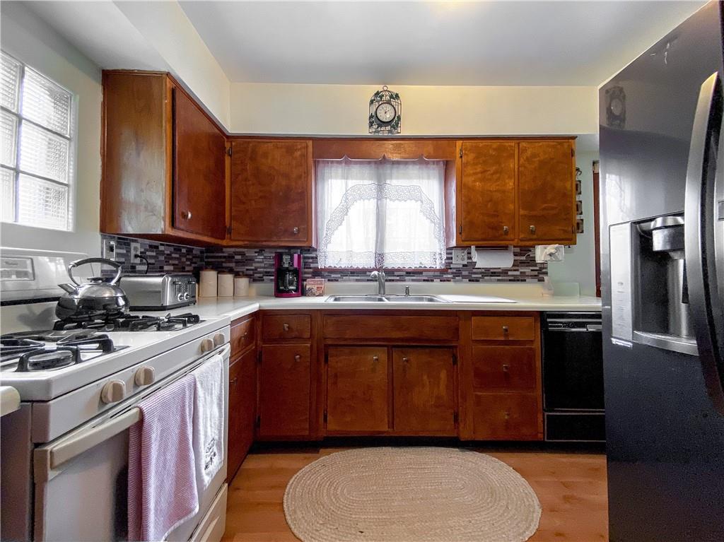 145 Stuber Road New Brighton, PA 15066 - Photo 15 of 27 a kitchen with a sink stove and refrigerator