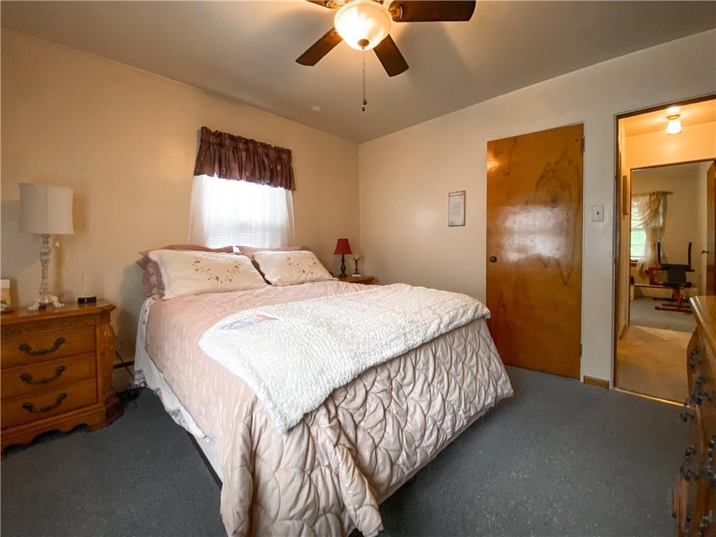 145 Stuber Road New Brighton, PA 15066 - Photo 18 of 27 a bedroom with a bed and a chandelier