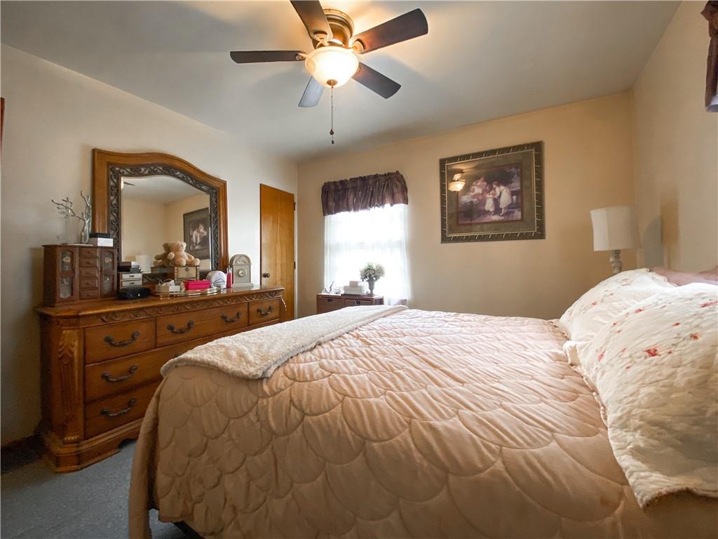 145 Stuber Road New Brighton, PA 15066 - Photo 19 of 27 a bedroom with a large bed and a chandelier