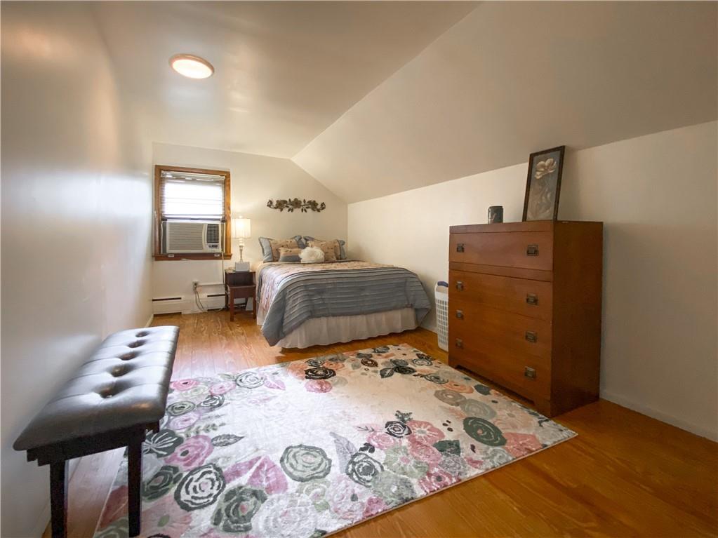 145 Stuber Road New Brighton, PA 15066 - Photo 20 of 27 a bedroom with a bed and wooden floor