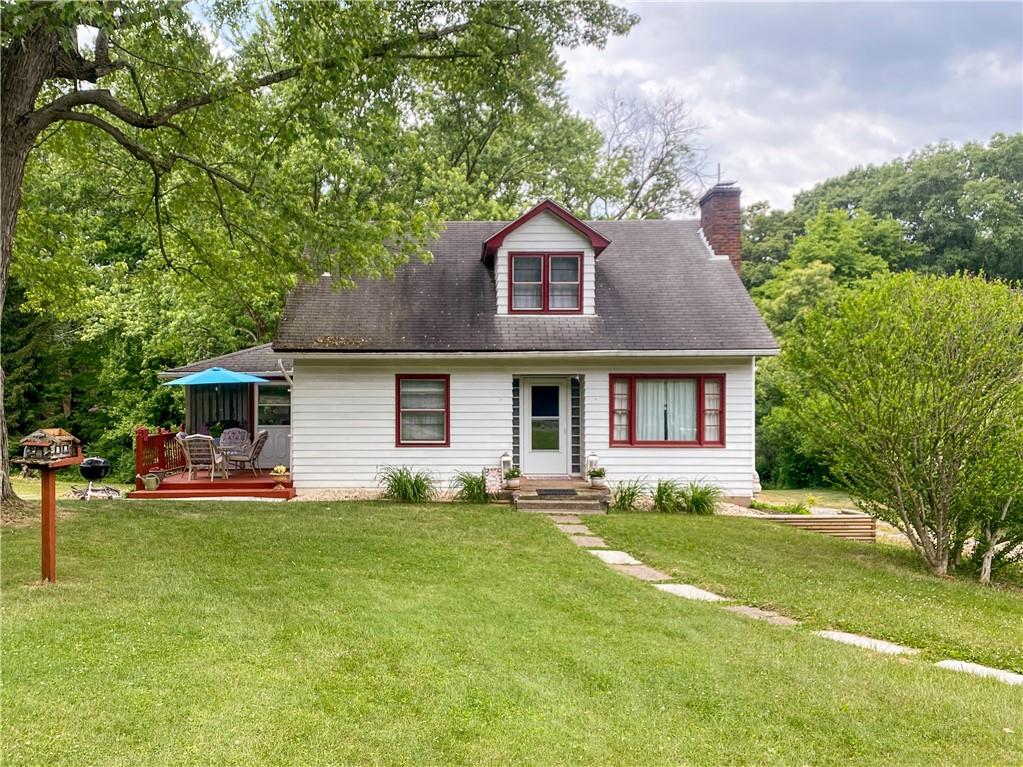 145 Stuber Road New Brighton, PA 15066 - Photo 2 of 27 a front view of a house with a garden and trees