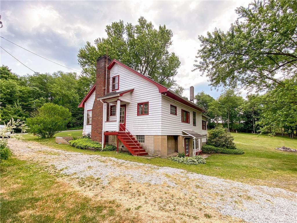145 Stuber Road New Brighton, PA 15066 - Photo 3 of 27 a front view of a house with a yard