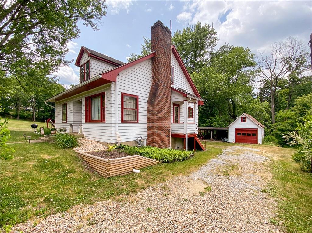 145 Stuber Road New Brighton, PA 15066 - Photo 4 of 27 a view of a house with a yard and a patio