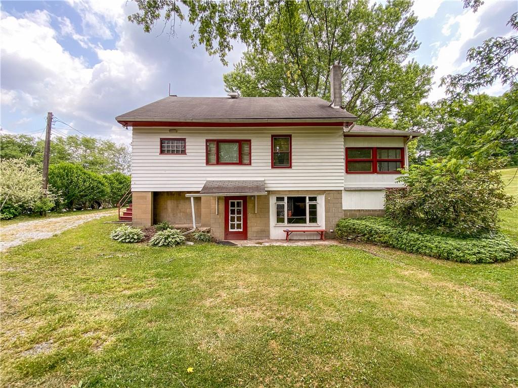 145 Stuber Road New Brighton, PA 15066 - Photo 5 of 27 a view of a house with a yard and sitting area