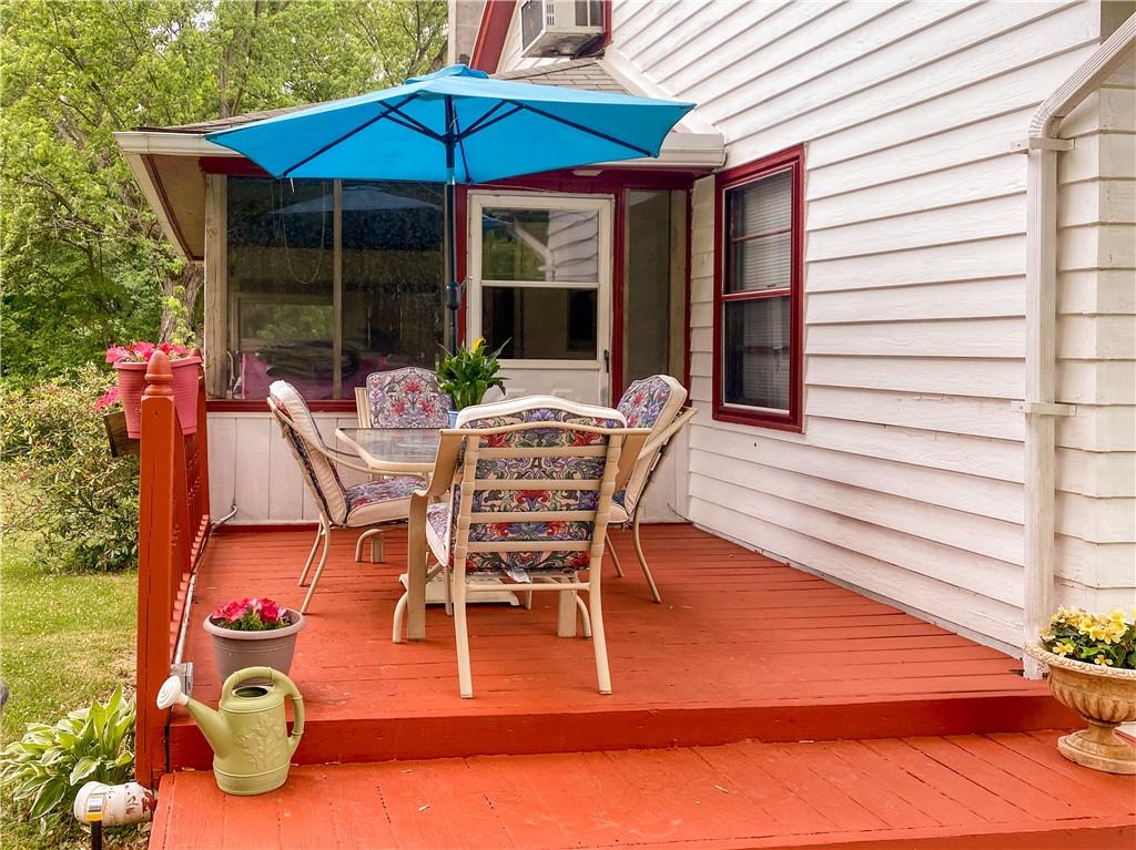 145 Stuber Road New Brighton, PA 15066 - Photo 9 of 27 a view of a patio with table and chairs under an umbrella