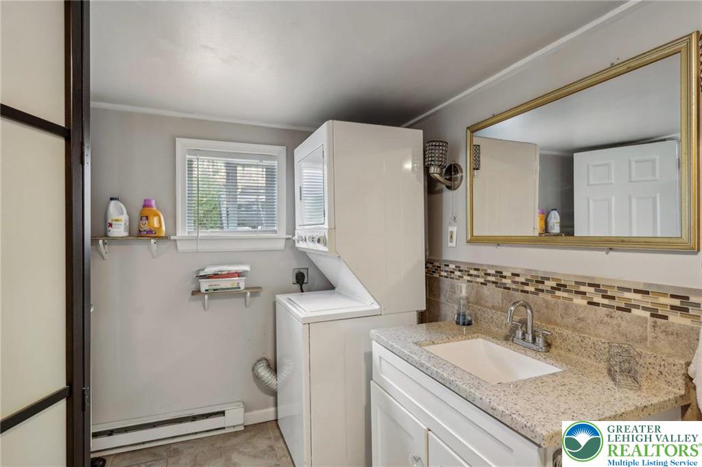 3203 Washington Street Bethlehem, PA 18020 - Photo 14 of 14 a bathroom with a sink a toilet and a mirror