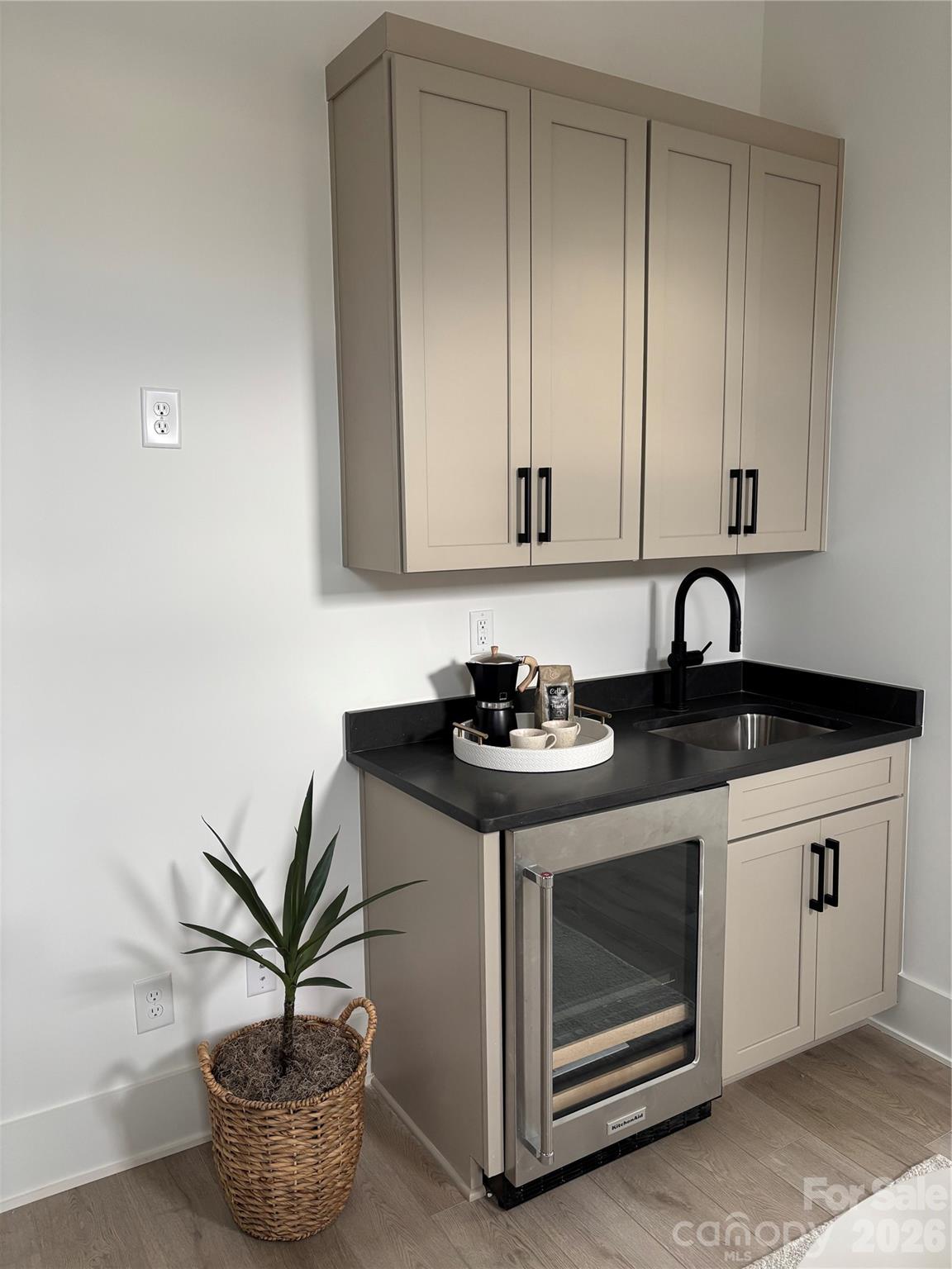 1027 Cox Road, Unit 12 Weddington, NC 28104 - Photo 16 of 32 a kitchen with a stove and a potted plant
