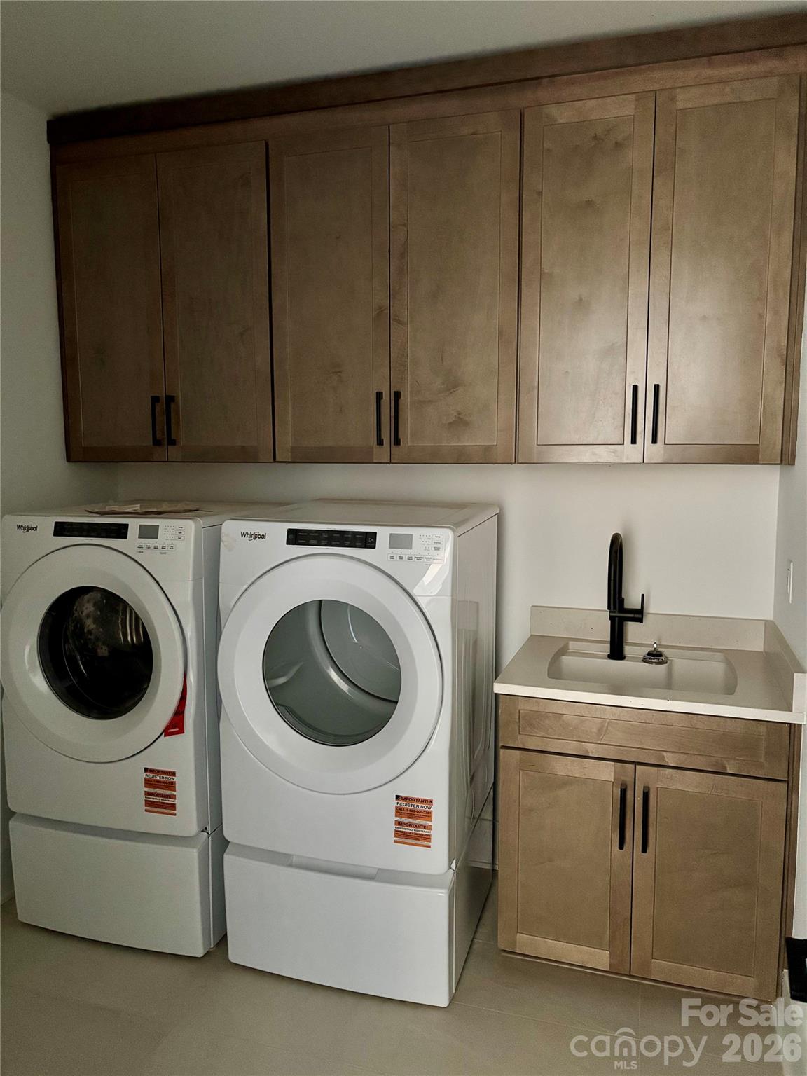 1027 Cox Road, Unit 12 Weddington, NC 28104 - Photo 22 of 32 a utility room with sink dryer and washer