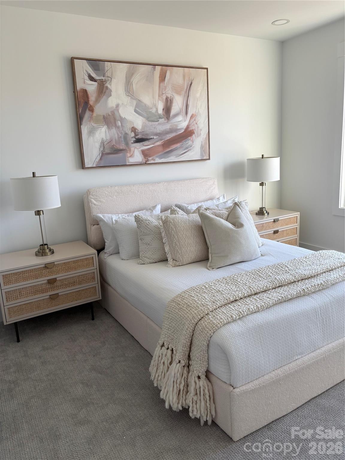 1027 Cox Road, Unit 12 Weddington, NC 28104 - Photo 27 of 32 a bedroom with a bed and a painting on the wall