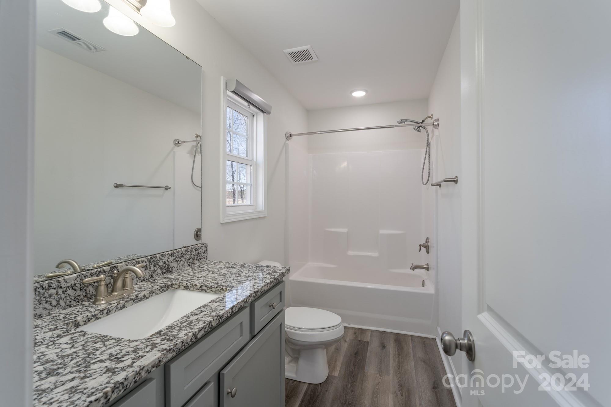1121 Thompson Davis Road York, SC 29745 - Photo 15 of 28 a bathroom with a granite countertop sink toilet and shower