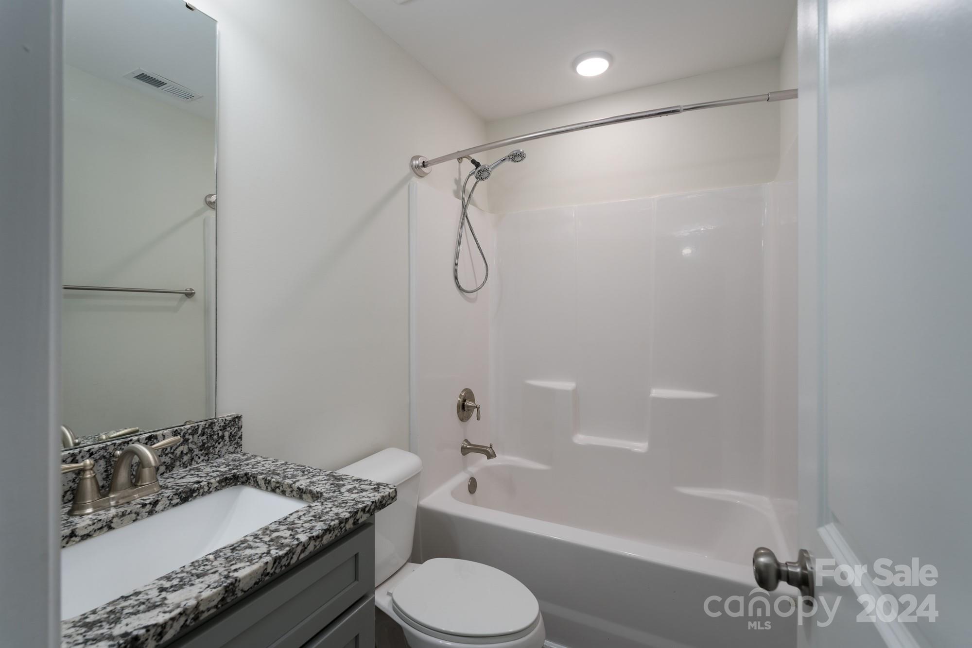 1121 Thompson Davis Road York, SC 29745 - Photo 18 of 28 a bathroom with a granite countertop sink toilet and shower
