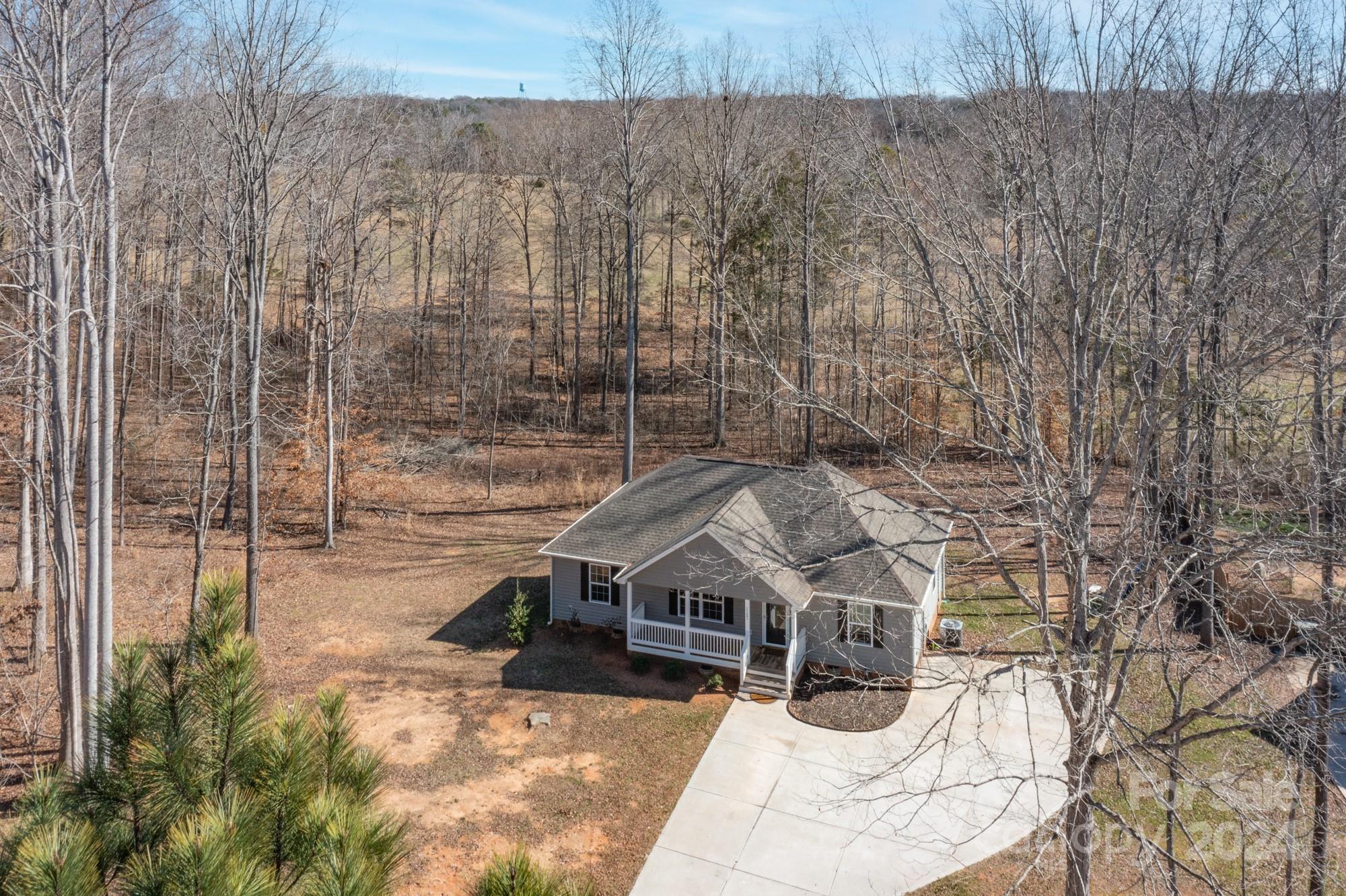 1121 Thompson Davis Road York, SC 29745 - Photo 26 of 28 a view of a house with a wooden wall and roof