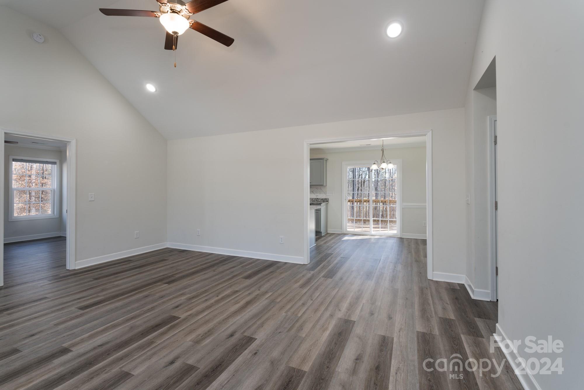 1121 Thompson Davis Road York, SC 29745 - Photo 3 of 28 wooden floor in an empty room with a window