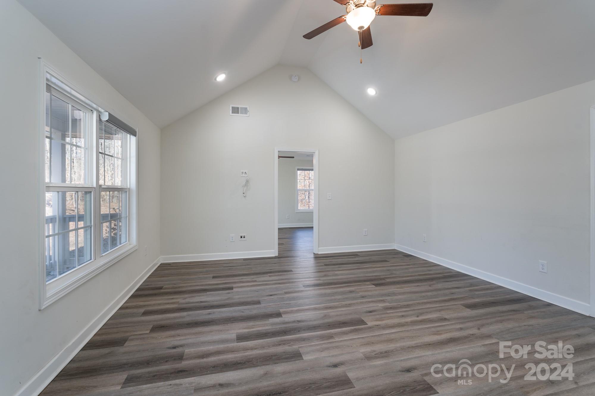 1121 Thompson Davis Road York, SC 29745 - Photo 5 of 28 wooden floor in an empty room with a window
