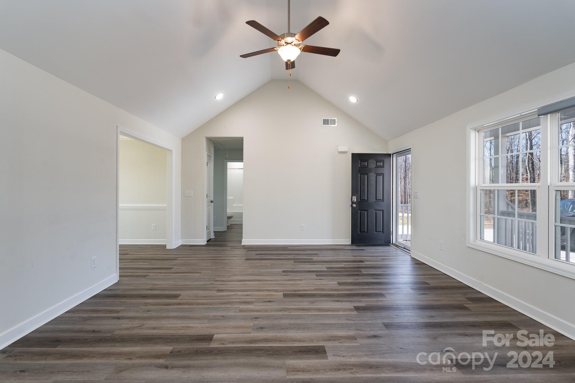 1121 Thompson Davis Road York, SC 29745 - Photo 6 of 28 a view of an empty room with window and wooden floor
