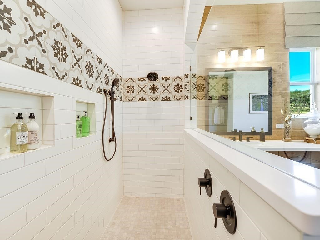 175 Call Drive Austin, TX 78737 - Photo 14 of 28 a bathroom with a sink and mirror