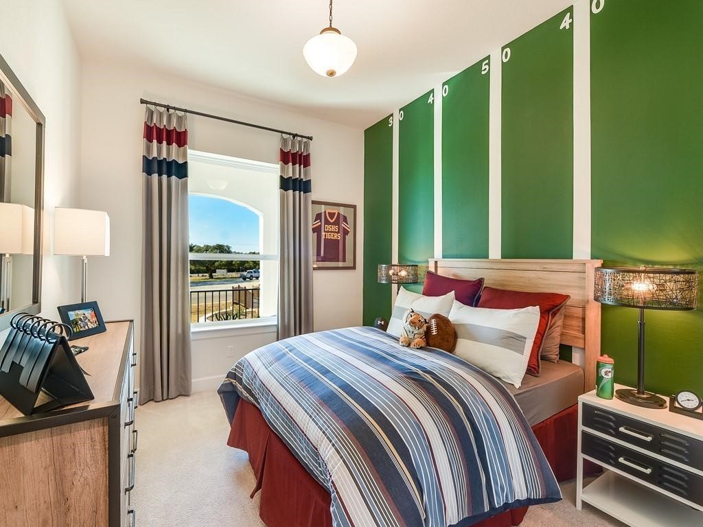 175 Call Drive Austin, TX 78737 - Photo 18 of 28 a bedroom with a bed and a large window