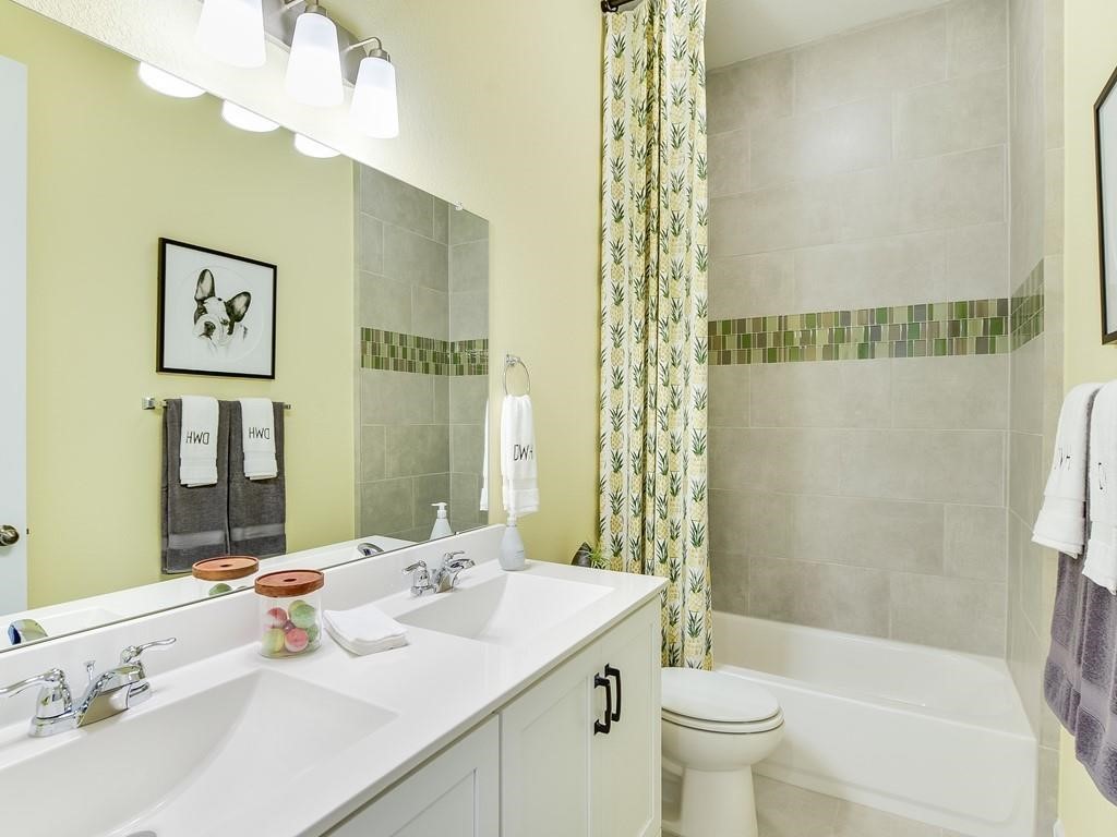 175 Call Drive Austin, TX 78737 - Photo 20 of 28 a bathroom with a sink a toilet and shower