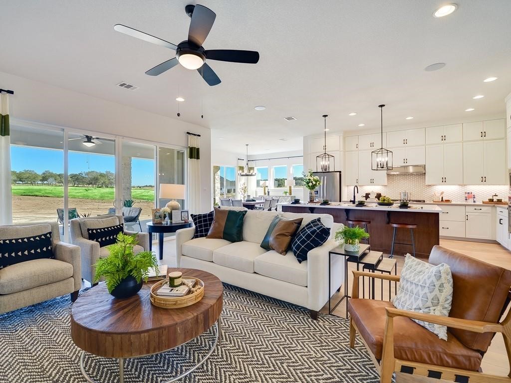 175 Call Drive Austin, TX 78737 - Photo 2 of 28 a living room with furniture kitchen view and a large window
