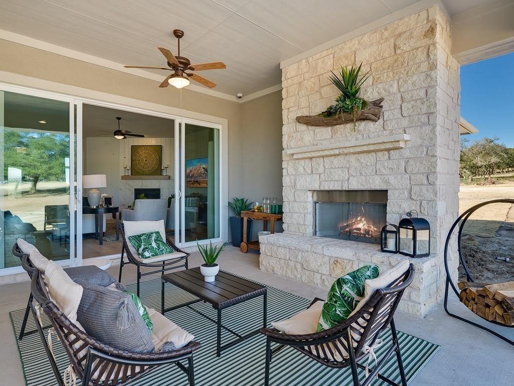 175 Call Drive Austin, TX 78737 - Photo 21 of 28 a living room with furniture and a fireplace