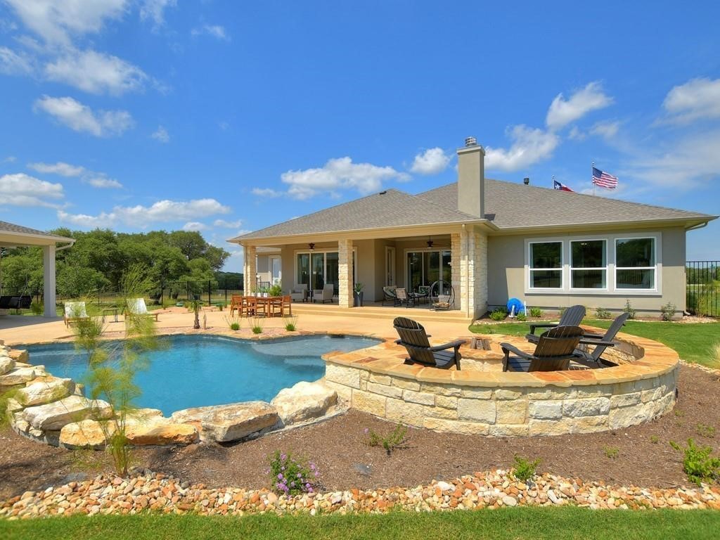 175 Call Drive Austin, TX 78737 - Photo 27 of 28 a view of a house with swimming pool and sitting area
