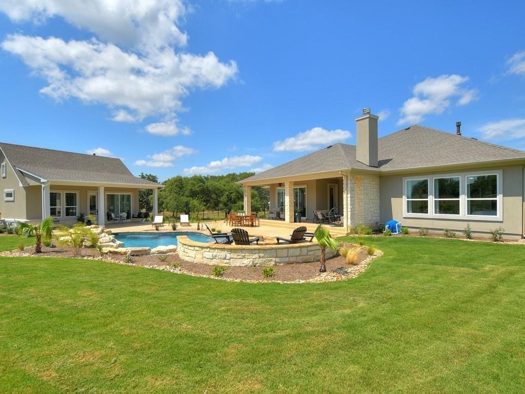 175 Call Drive Austin, TX 78737 - Photo 4 of 28 a view of a house with backyard sitting area and garden