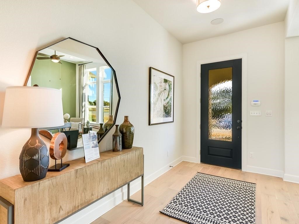 175 Call Drive Austin, TX 78737 - Photo 5 of 28 a bedroom with a bed and a mirror