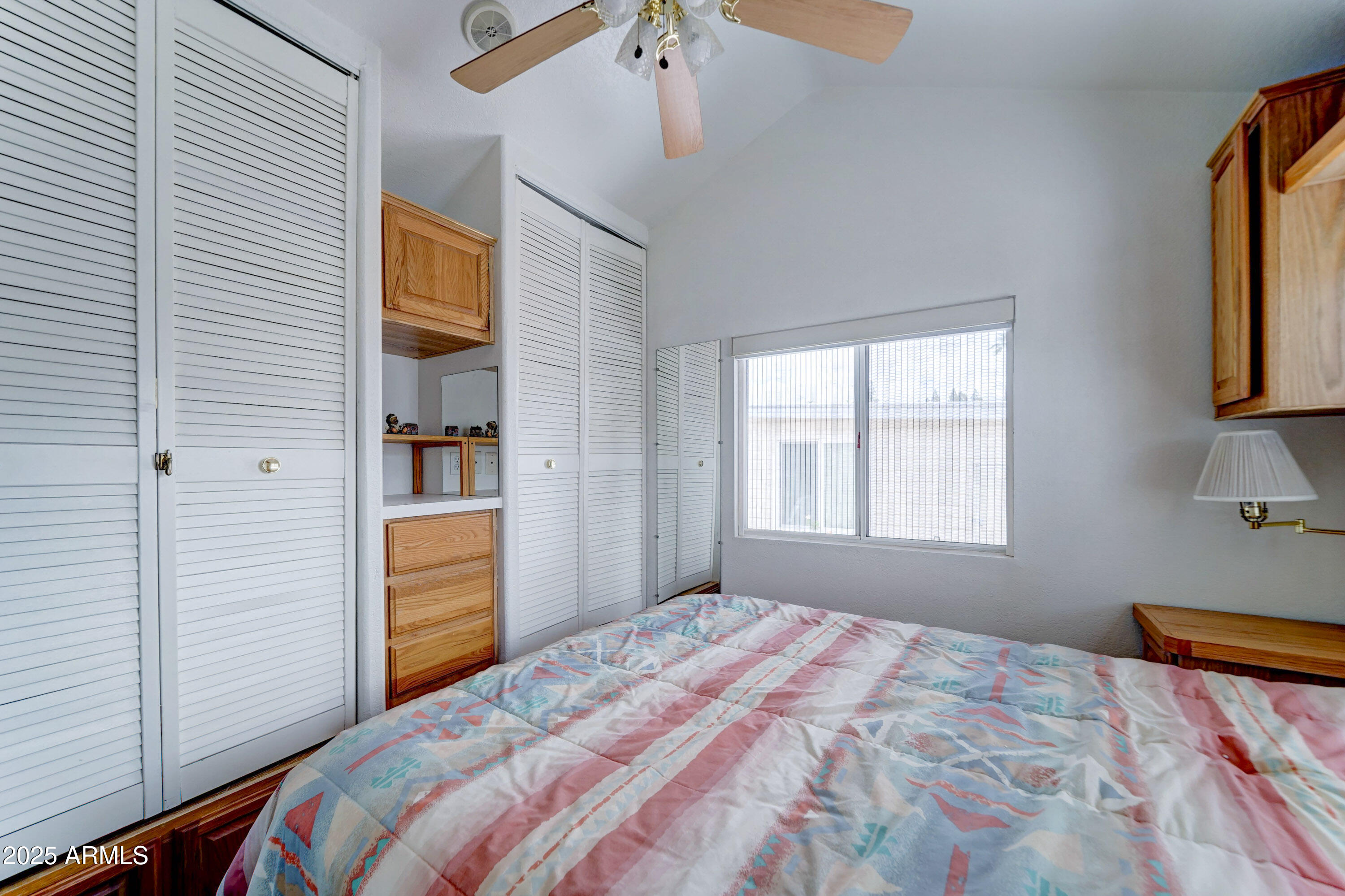 111 South Greenfield Road, Unit 552 Mesa, AZ 85206 - Photo 10 of 24 a bedroom with a bed and a window