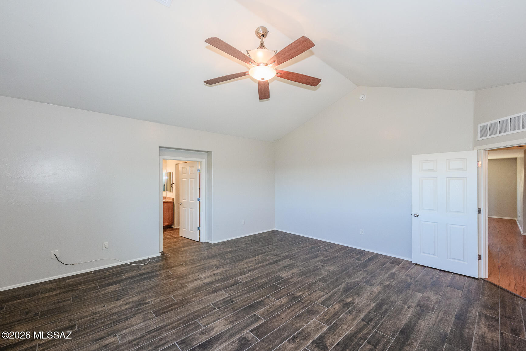 728 South Porter Routh Place Vail, AZ 85641 - Photo 27 of 36 an empty room with wooden floor and ceiling fan