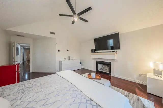 a bathroom with a double vanity sink mirror and shower