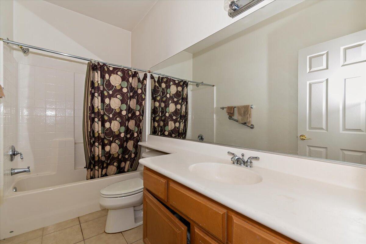 49528 Pacino Street Indio, CA 92201 - Photo 12 of 22 a bathroom with a sink toilet and shower