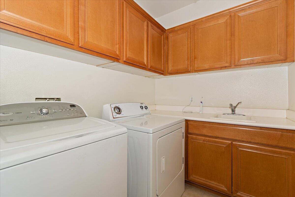 49528 Pacino Street Indio, CA 92201 - Photo 13 of 22 a utility room with dryer and washer