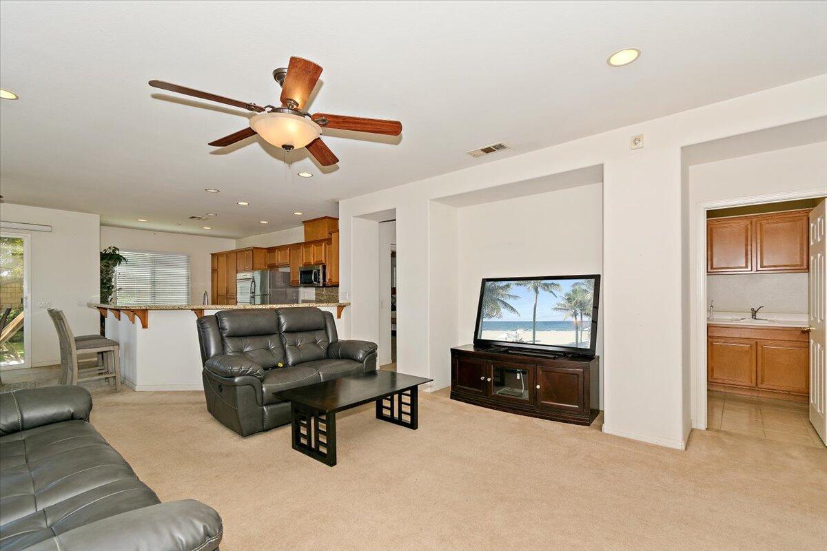 49528 Pacino Street Indio, CA 92201 - Photo 2 of 22 a living room with furniture and a flat screen tv