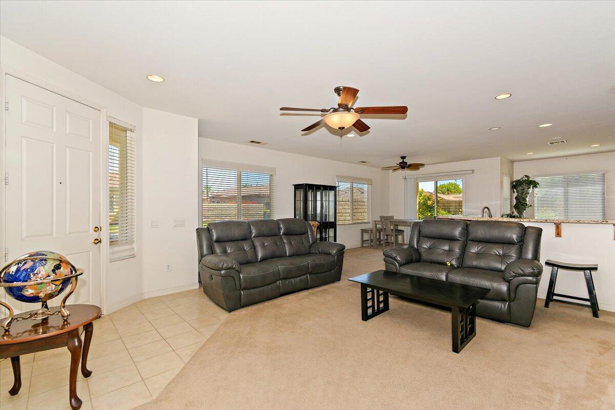 49528 Pacino Street Indio, CA 92201 - Photo 3 of 22 a living room with furniture and a wooden floor