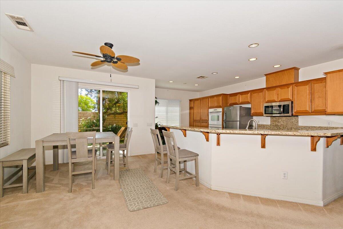 49528 Pacino Street Indio, CA 92201 - Photo 6 of 22 a view of kitchen with furniture and window