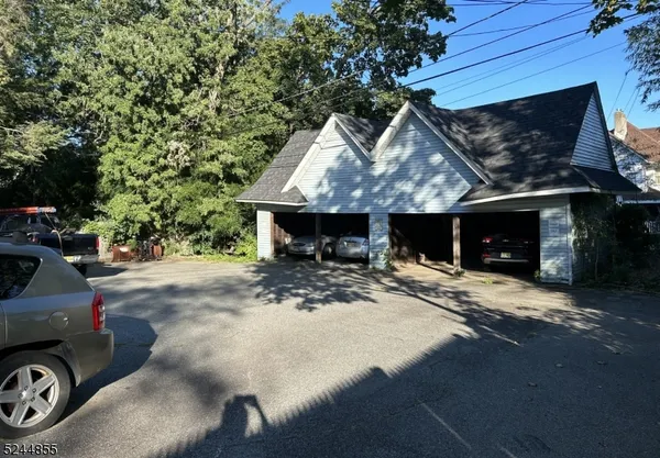 a view of a car park in front of house
