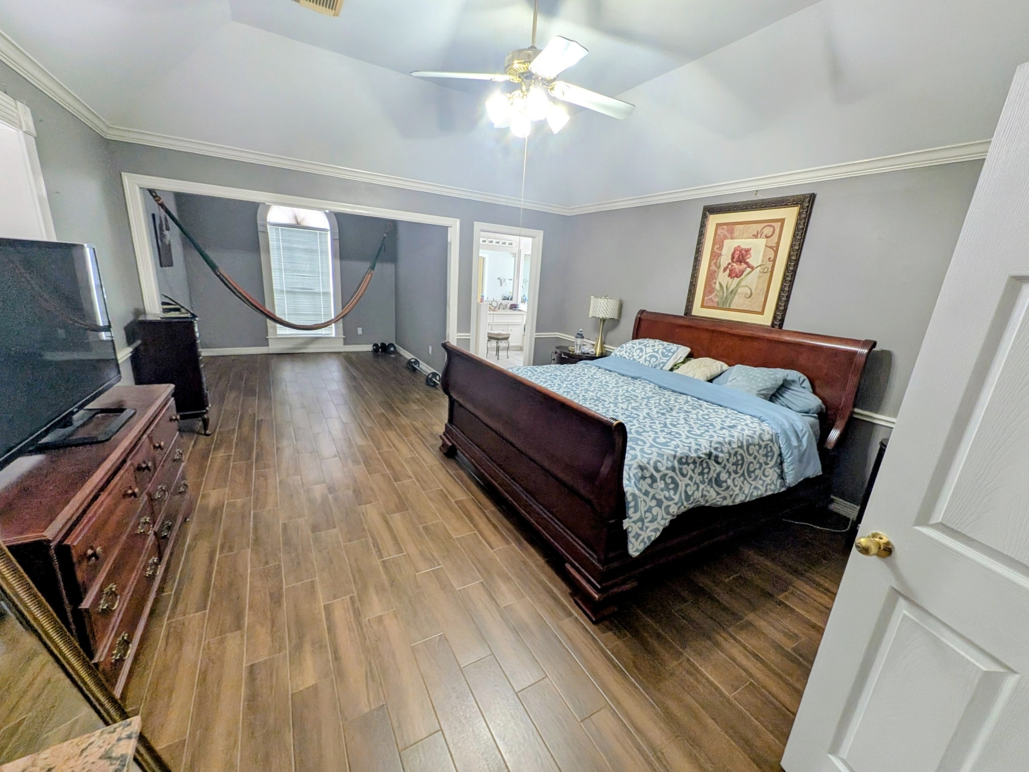 13107 Walnut Lake Road Houston, TX 77065 - Photo 18 of 21 a bed sitting in a bedroom next to a window