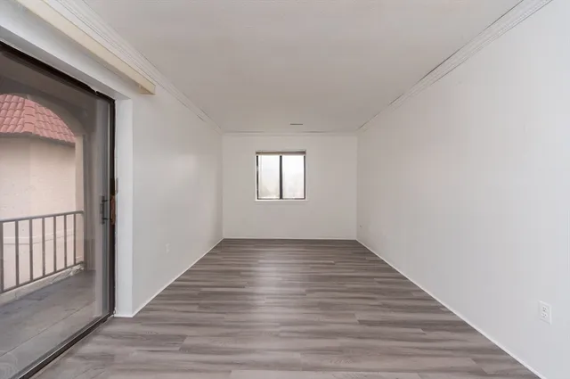 a view of an empty room and window